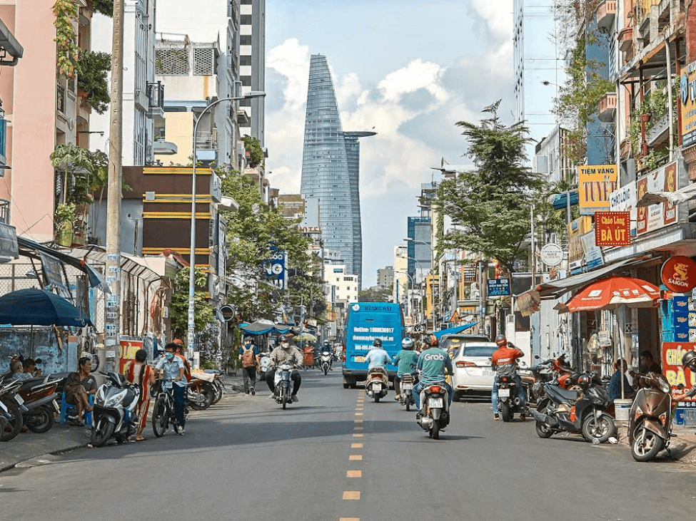 Bustling streets of Ho Chi Minh City under clear skies.