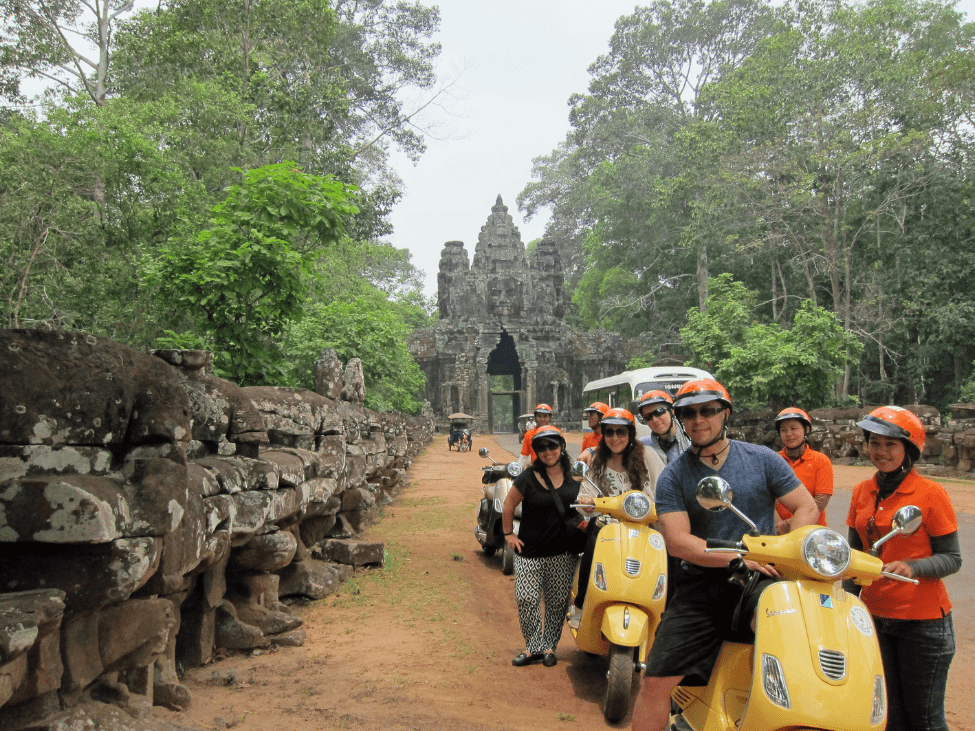 Tourist with a local guide at Angkor.