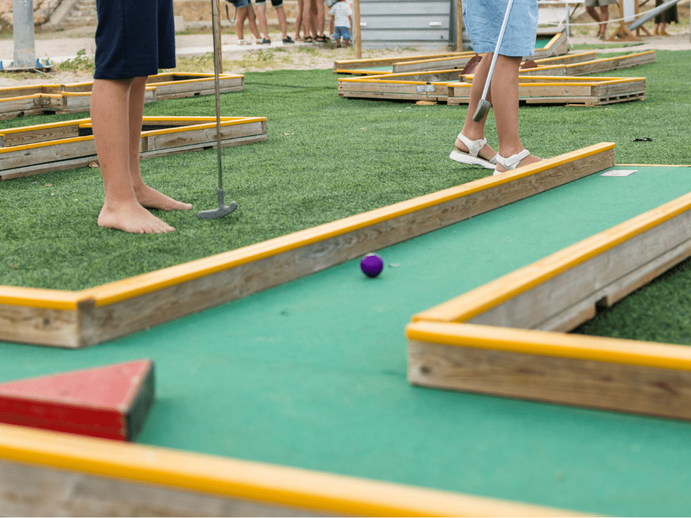 Family playing mini golf at Angkor Wat Putt