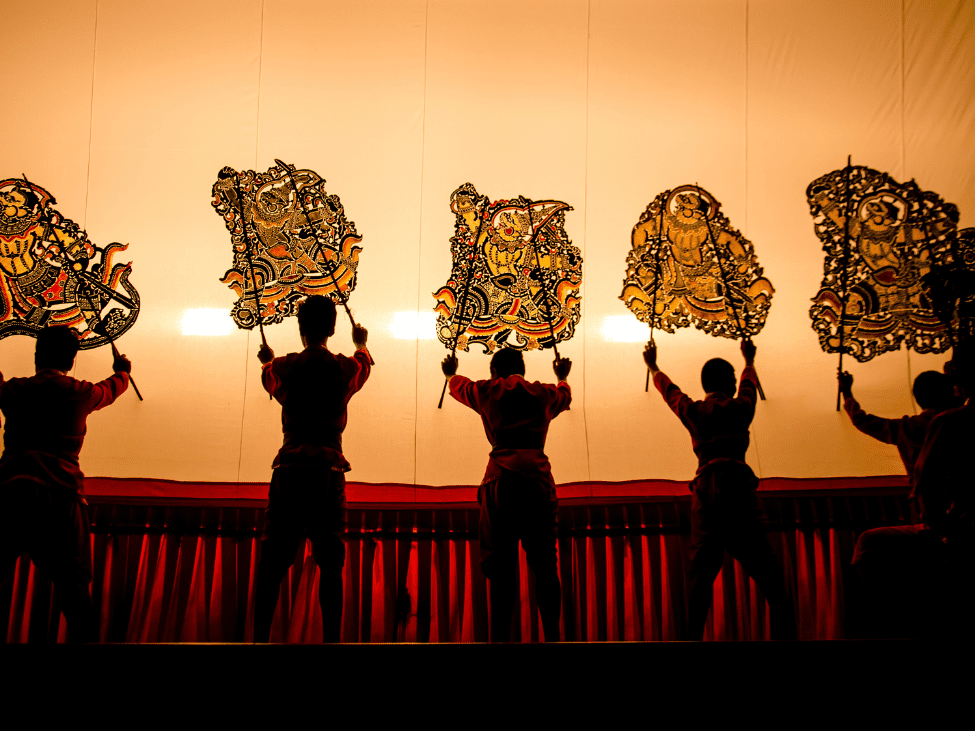 Children watching a puppet show at Bambu Stage