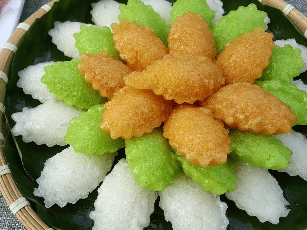 Colorful slices of Bánh Bò arranged on a plate.