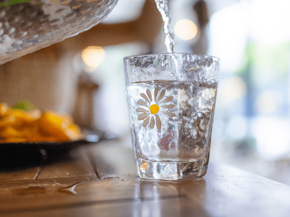 Bottled water being poured into a glass in Vietnam