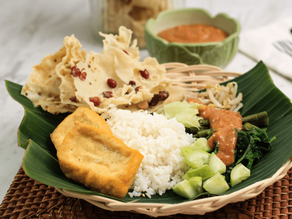 Plate of vegetarian rice dish with tofu and vegetables in Vietnam