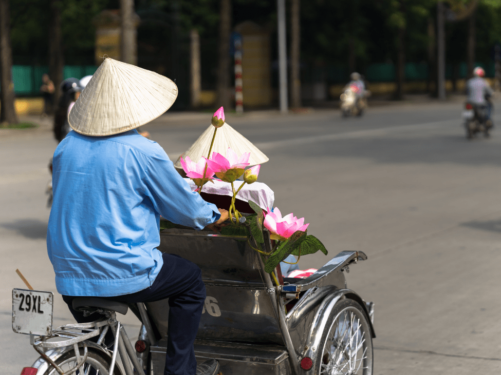 Family enjoying a cyclo ride in Hanoi's Old Quarter