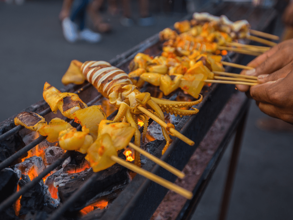 Grilled squid being prepared at Ninh Kieu Night Market.