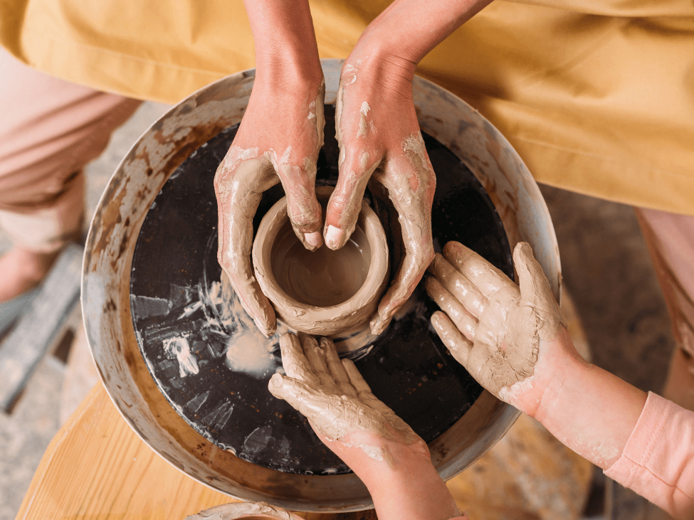 Family learning pottery at the Khmer Ceramics Fine Arts Centre