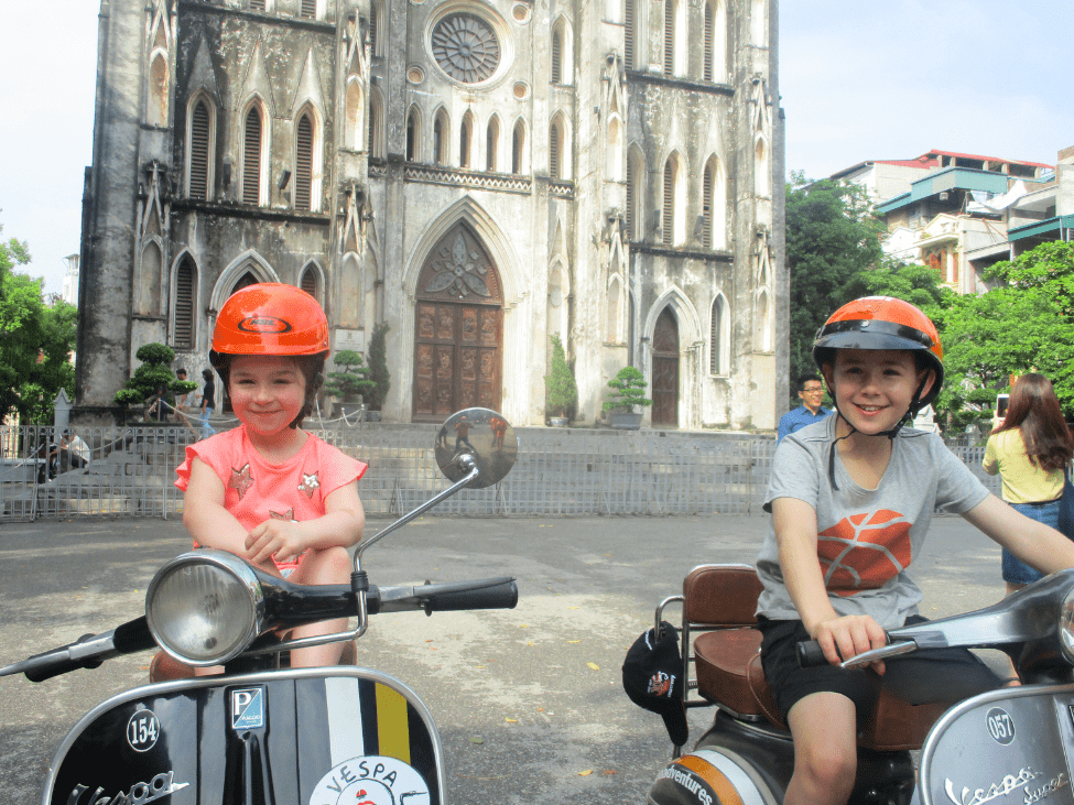 Children having fun on a Vespa adventure in Hanoi