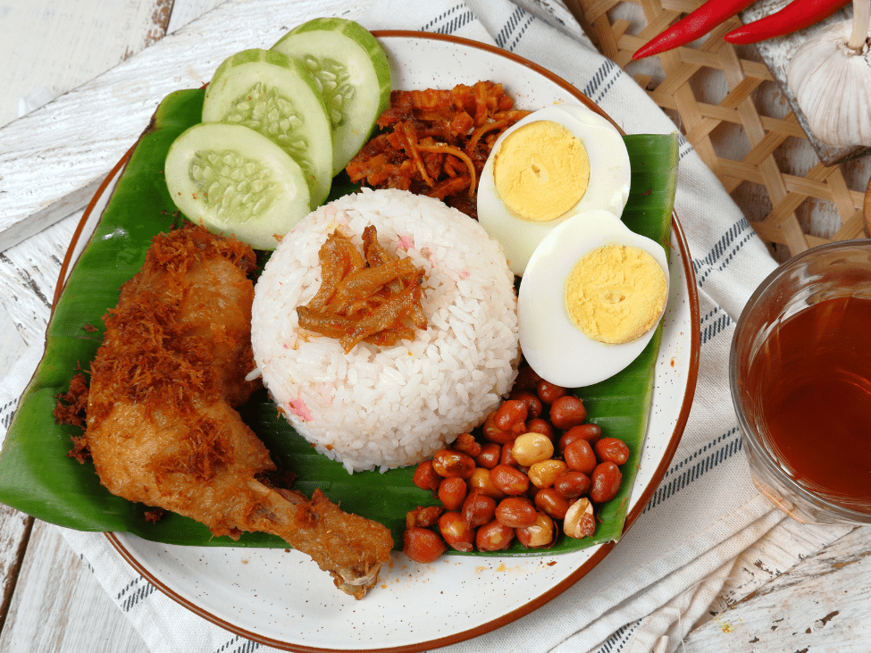 Nasi Lemak with anchovies, peanuts, and boiled egg in Malaysia