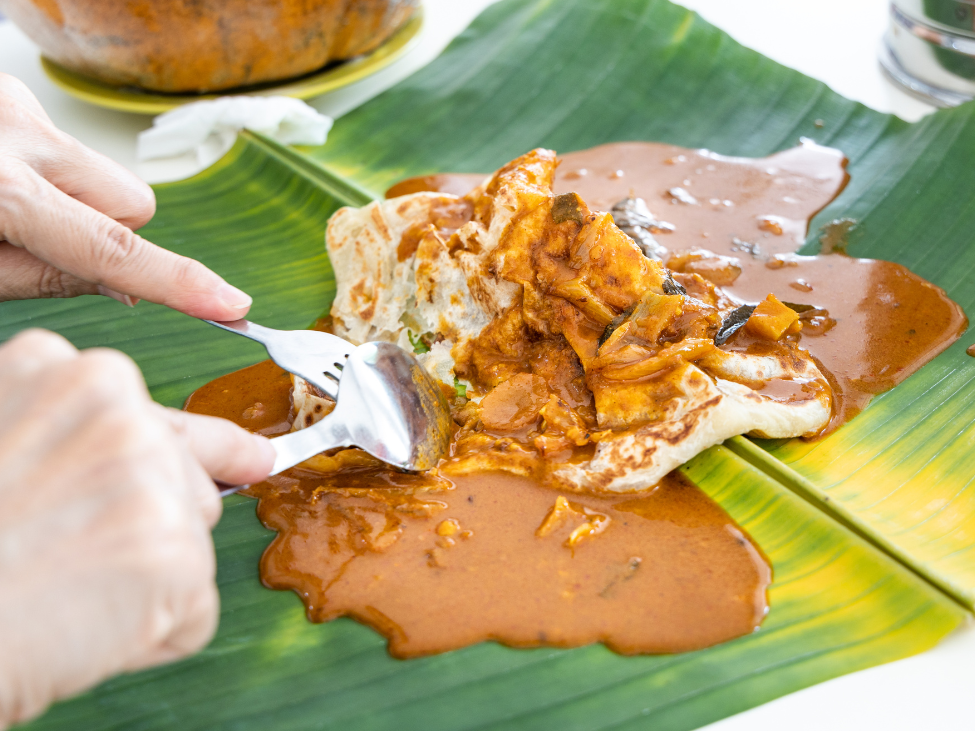 Roti Canai with curry dipping sauce in Malaysia