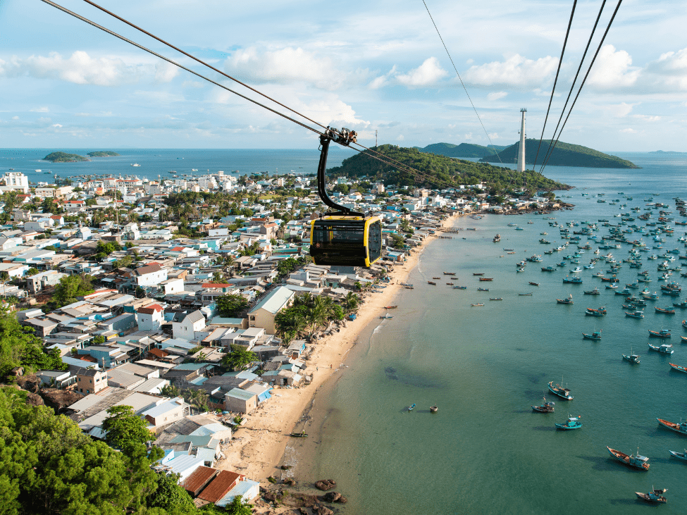 Sunny beach in Phu Quoc with clear waters and palm trees during the monsoon season