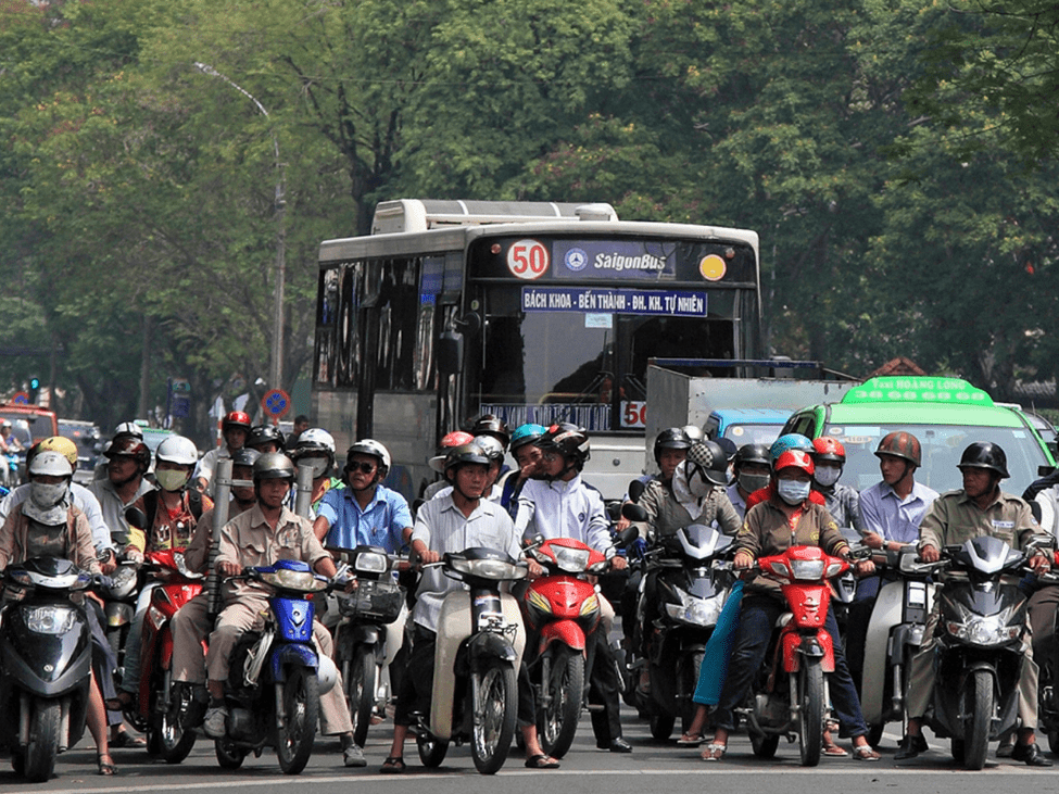 Vietnamese bus on a busy street.