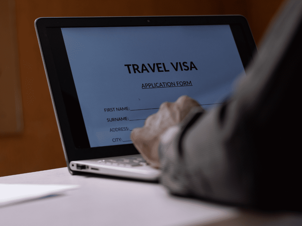 Traveler checking Vietnam visa requirements on a laptop