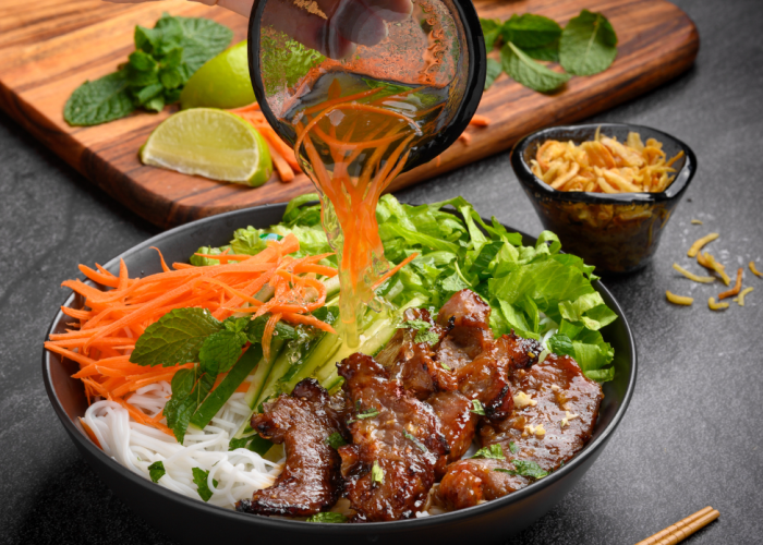 Bun Thit Nuong with grilled pork and fresh vegetables.