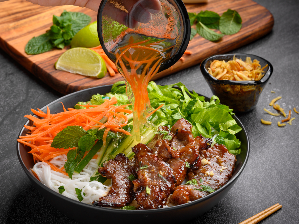 Bun Thit Nuong with grilled pork and fresh vegetables.