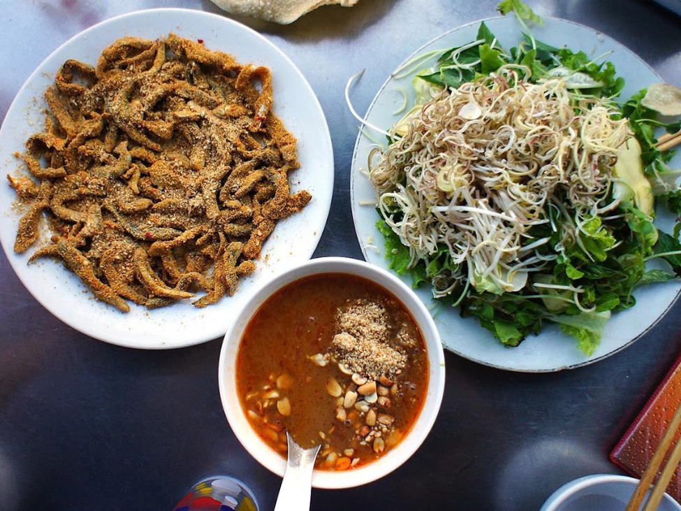 Goi Ca Nam O fish salad with herbs and vegetables.