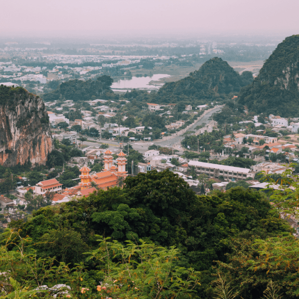 Panoramic view from the peak of Thuy Son Mountain, showcasing Da Nang's coastline and cityscape.