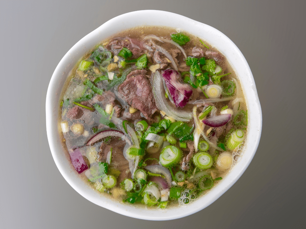 Balanced broth and perfectly cooked noodles in a bowl of pho at Pho 10 Ly Quoc Su in Hanoi.