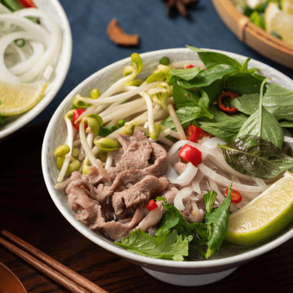 A steaming bowl of pho noodle soup at Pho Hung Vuong 2 in Richmond, Melbourne.