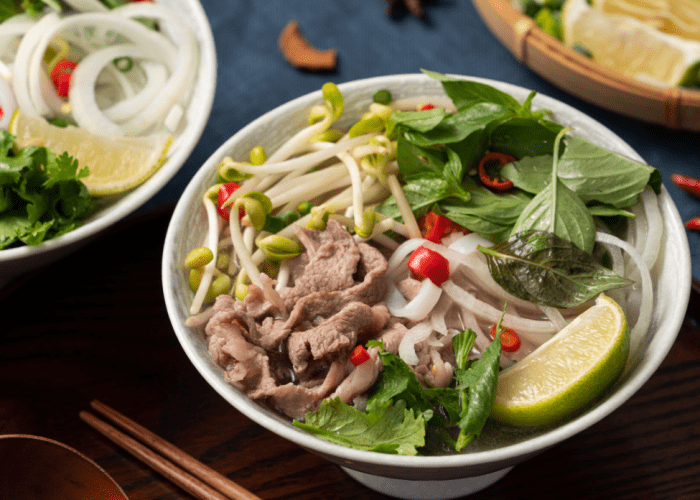 A steaming bowl of pho noodle soup at Pho Hung Vuong 2 in Richmond, Melbourne.