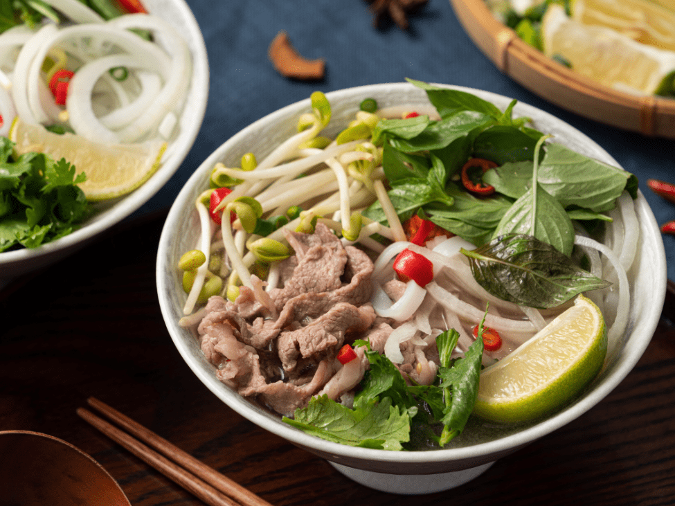 A steaming bowl of pho noodle soup at Pho Hung Vuong 2 in Richmond, Melbourne.