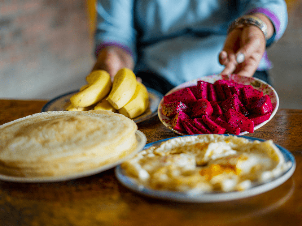 Local family hosting travelers in a Sapa homestay.