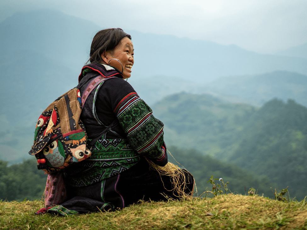 Traveler trekking through scenic Sapa hill tribes.