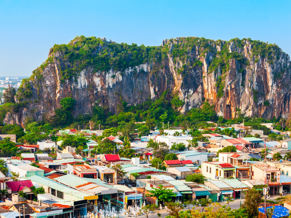 Panoramic view from the peak of Thuy Son Mountain, showcasing Da Nang's coastline and cityscape.