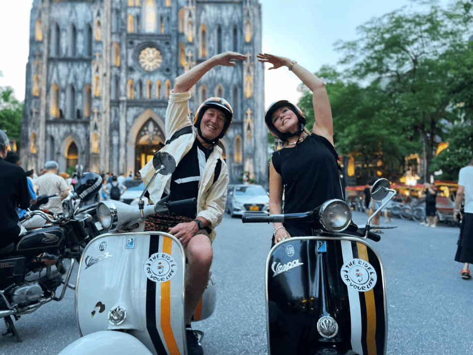 Couple exploring Vietnam on a Vespa