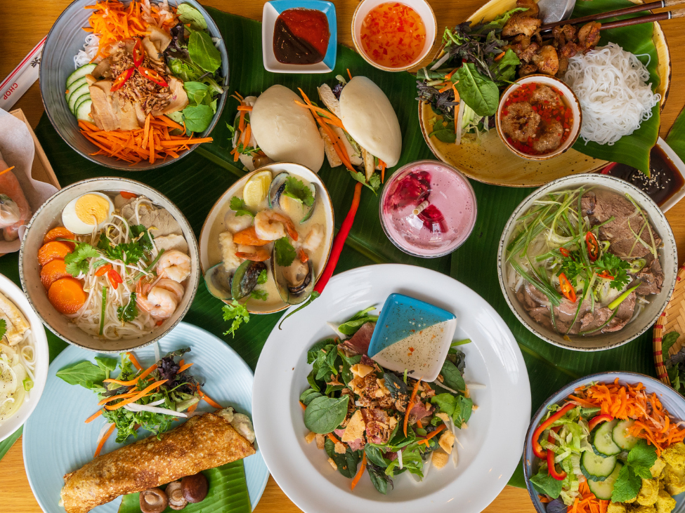 Couple enjoying a romantic dinner with Vietnamese cuisine