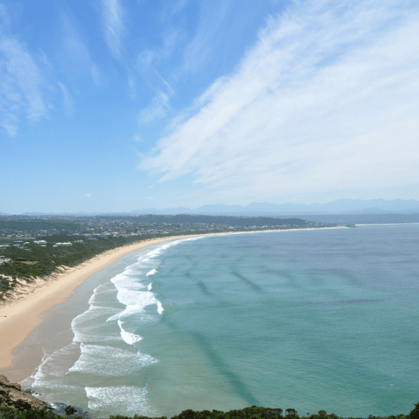 Crescent-shaped shoreline and clear waters of Bai Khem Beach.