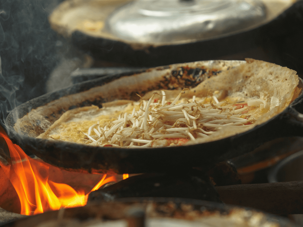 Crispy Banh Xeo being served at Ho Thi Ky food street in Saigon.