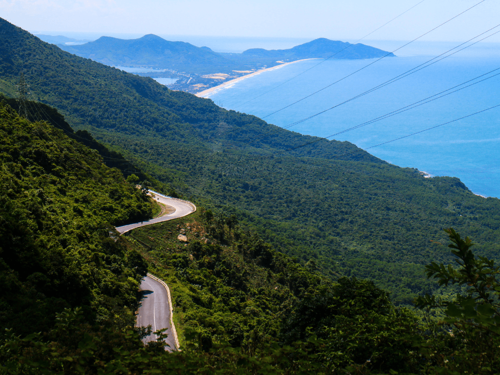 Hai Van Pass winding road with coastal views.