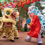 Traditional lion dancers performing in the streets of Hanoi during the Mid-Autumn Festival, bringing joy and good luck.