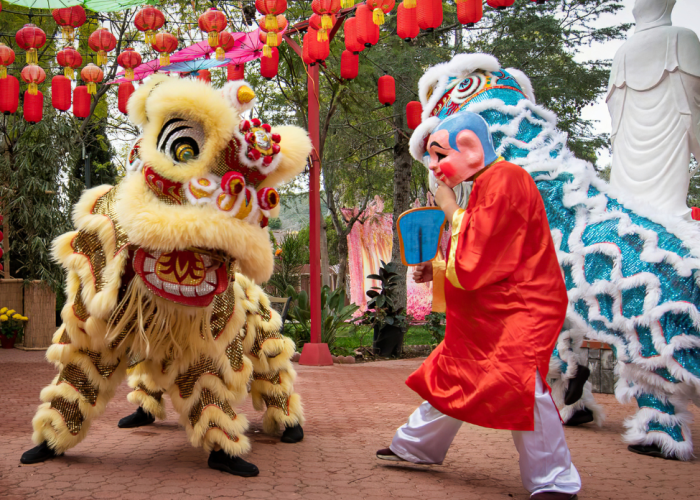 Traditional lion dancers performing in the streets of Hanoi during the Mid-Autumn Festival, bringing joy and good luck.