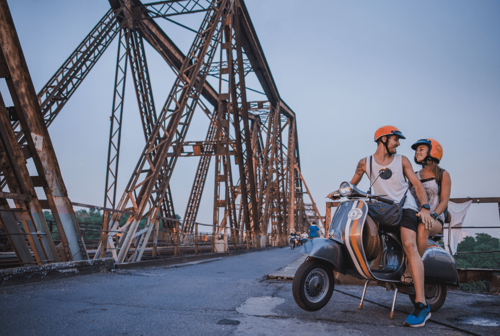 Hanoi’s Old Quarter bustling with lights and markets, a Vespa tour gliding through the streets.