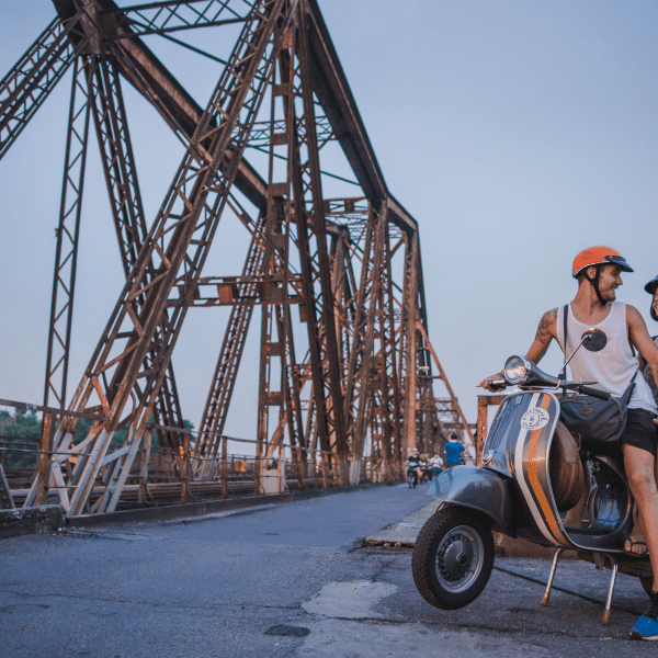 Hanoi’s Old Quarter bustling with lights and markets, a Vespa tour gliding through the streets.