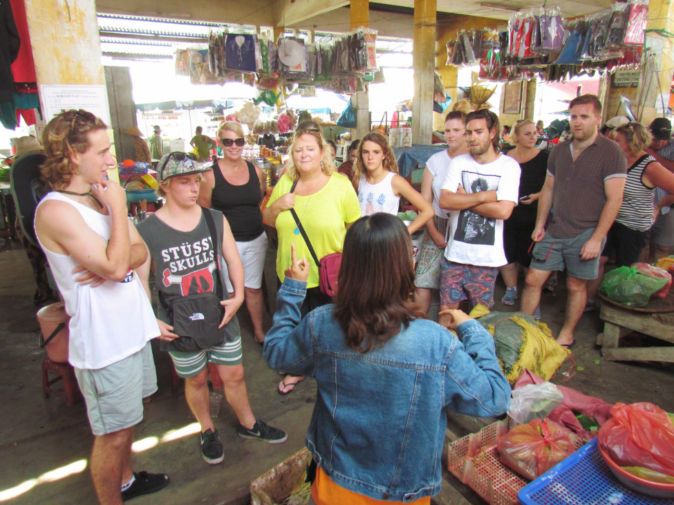 Street food vendor in Hoi An, serving up delicious local delicacies as part of the Streets and Eats Vespa tour.