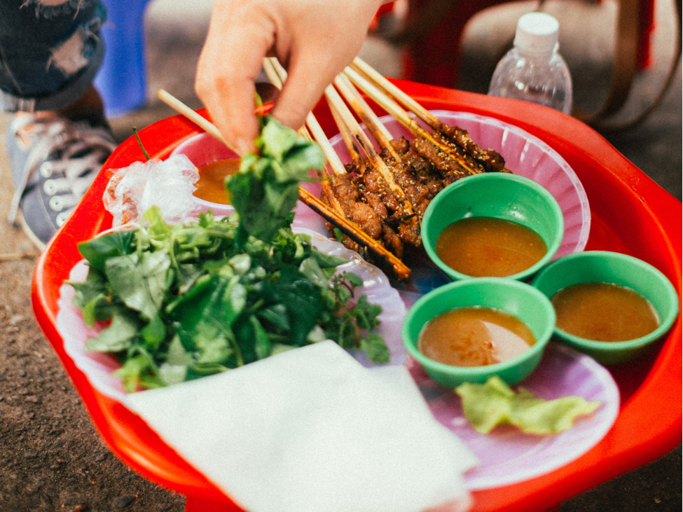 Street vendors serving local delicacies at the Hoi An lantern festival.