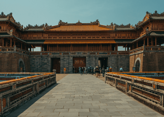 Ornate temples and walls of Hue Imperial City surrounded by tranquil gardens.