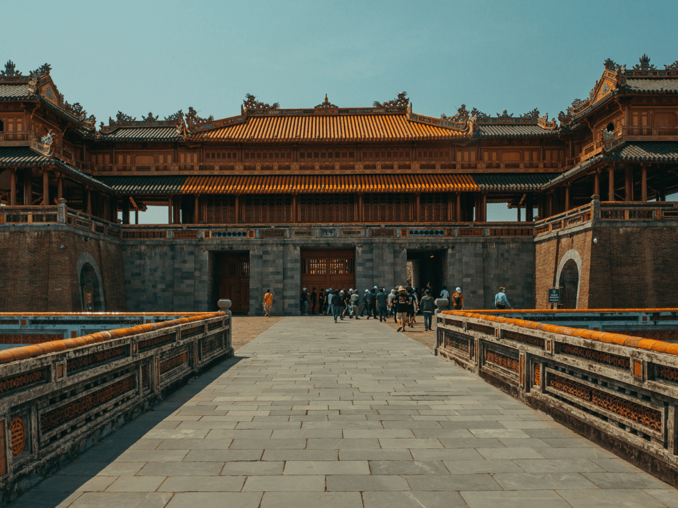 Ornate temples and walls of Hue Imperial City surrounded by tranquil gardens.