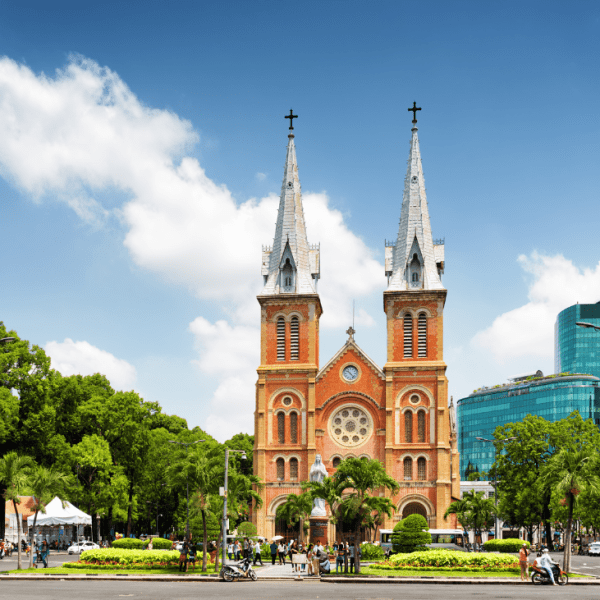 Interior view of the Notre Dame Cathedral of Saigon, showcasing stained glass windows and Gothic architecture.