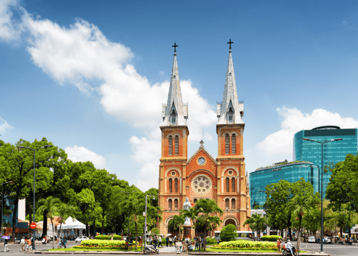 Interior view of the Notre Dame Cathedral of Saigon, showcasing stained glass windows and Gothic architecture.