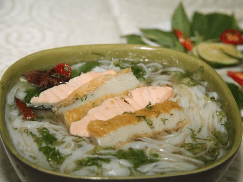 Traditional Phở Cá Dì Hai with local herbs in Can Tho.