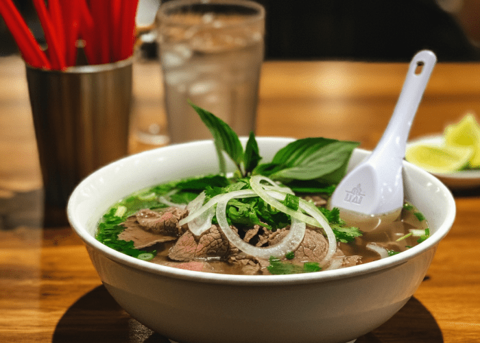 Traditional pho Hanoi style served at Pho Stop, Singapore, featuring aromatic broth and delicate rice noodles.