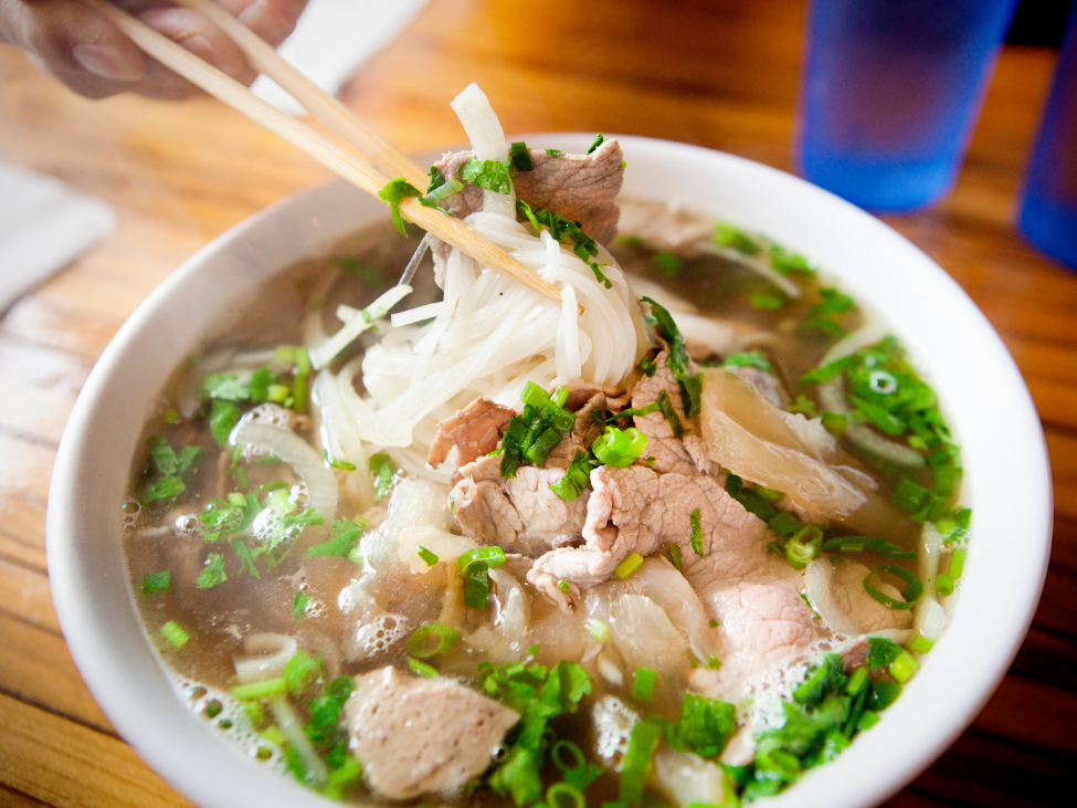 A bowl of rich, savory Pho served at Ho Thi Ky food street in Saigon.