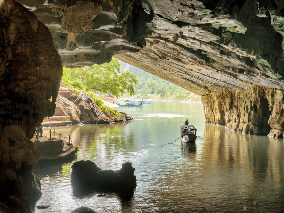 The entrance to Phong Nha-Ke Bang National Park with dense forests and mountain ranges.