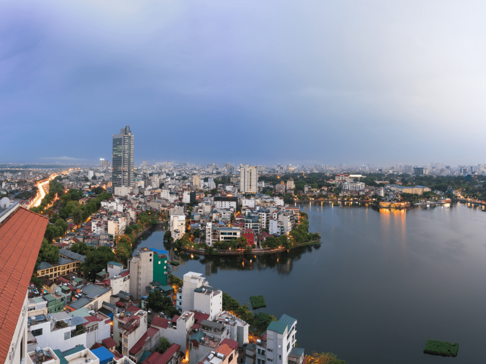 Serene West Lake, where tourists enjoy a snack of Bò Bía on the Hanoi Foodie Experience.