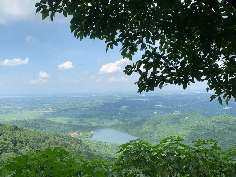 Misty mountains and lush greenery at Ba Vi National Park, Vietnam.