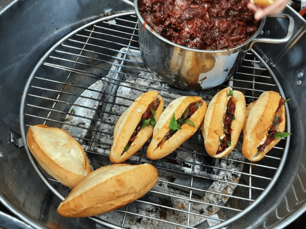 A fresh Banh Mi Hue sandwich filled with pork, pate, and vegetables