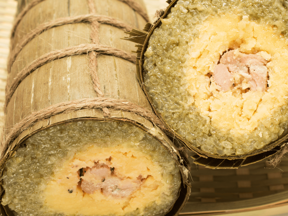 Banh Tet, a Vietnamese cylindrical sticky rice cake wrapped in banana leaves